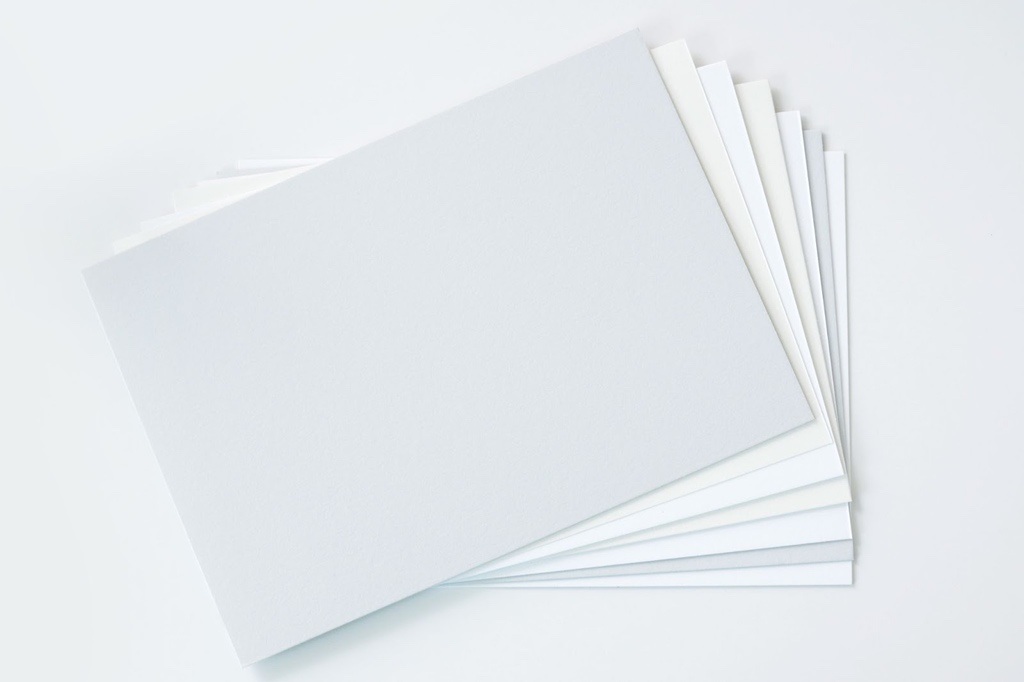 Different paper stock options on white background