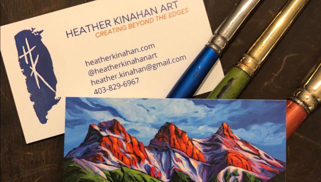 Business cards for Heather Kinahan Art with phone number, website, and email addres on one side and a painting of mountains on the other.