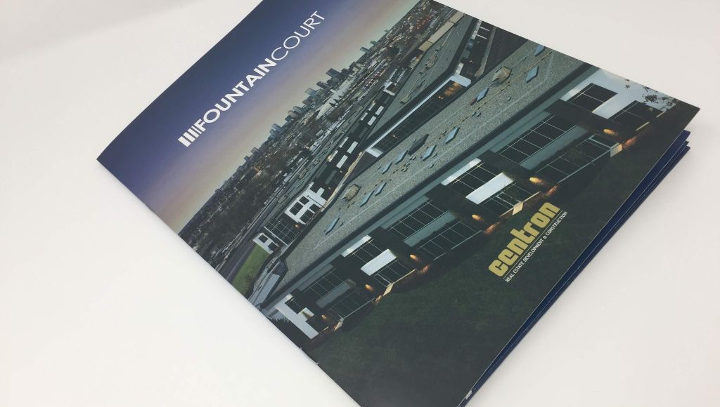 The front cover for the Fountain Court pocket folder. featuring a large commercial building with the Calgary skyline in the background.