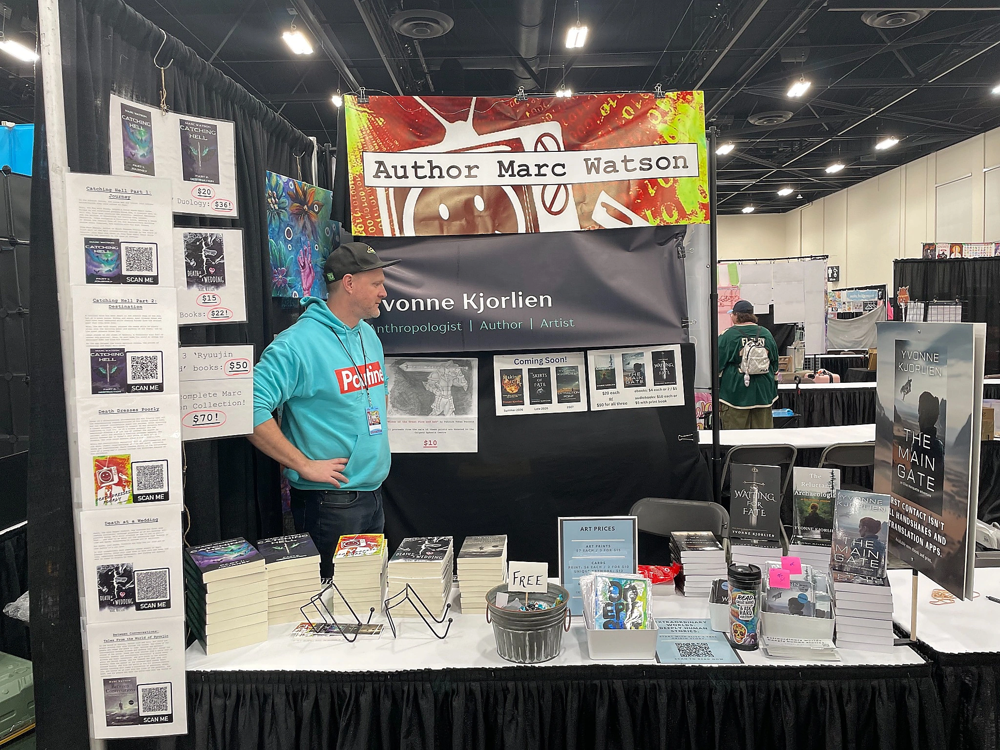 Calgary based artist and author at trade show with custom prints from Little Rock Printing
