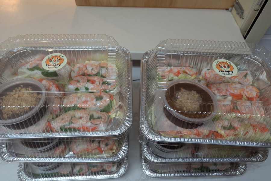Hungry Thaiger 28 Hungry Thaiger fresh shrimp spring rolls in clear takeout containers featuring custom labels printed at Little Rock Printing.